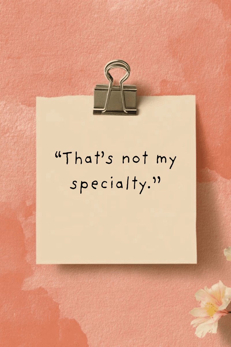 "That's not my specialty." handwritten in casual black font on a light tan paper square clipped with a silver binder clip, with small white flowers in the bottom right corner, set on a textured peach-pink background.