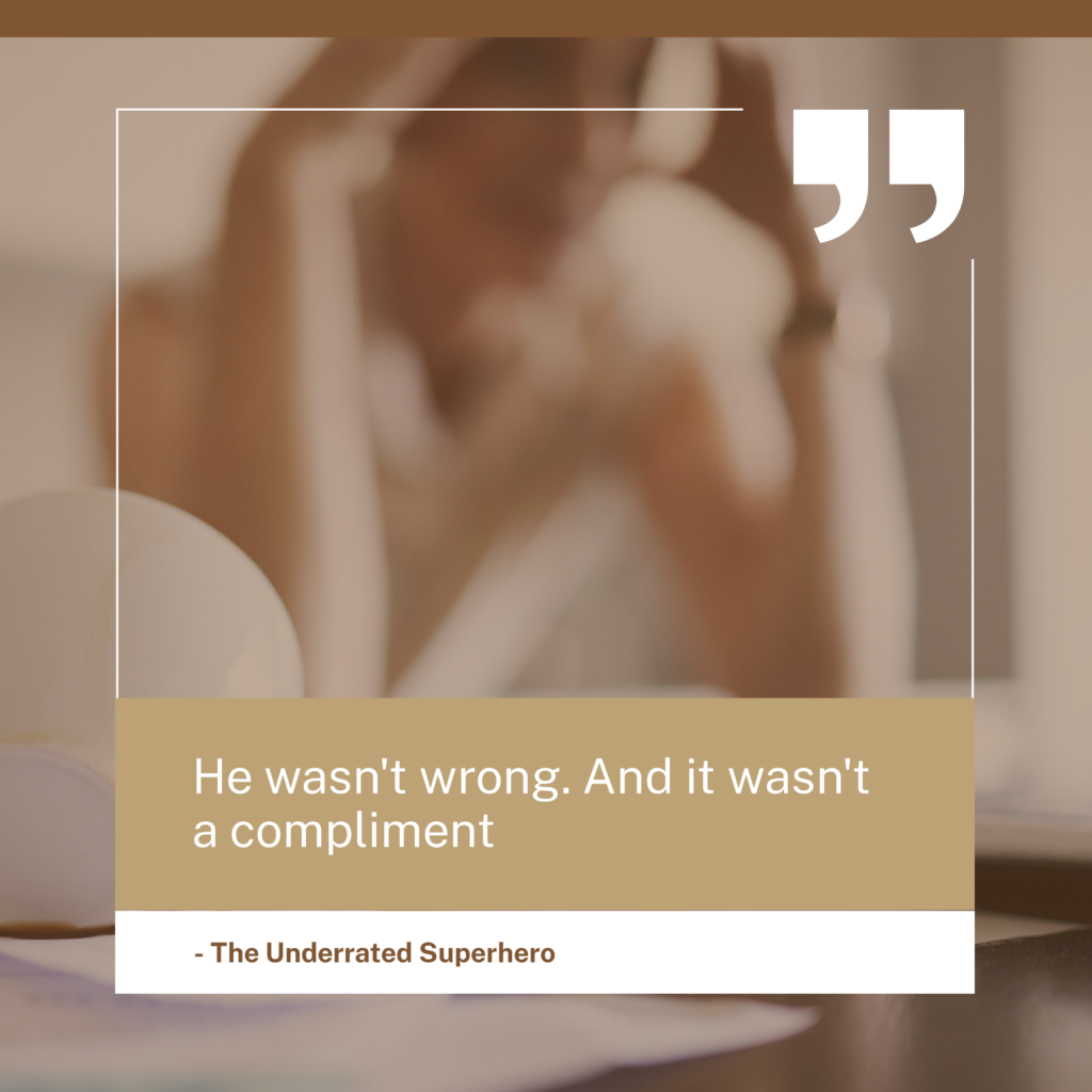 Quote graphic He wasn't wrong. And it wasn't a compliment" by The Underrated Superhero over a blurred background image with a white border and brown overlays.